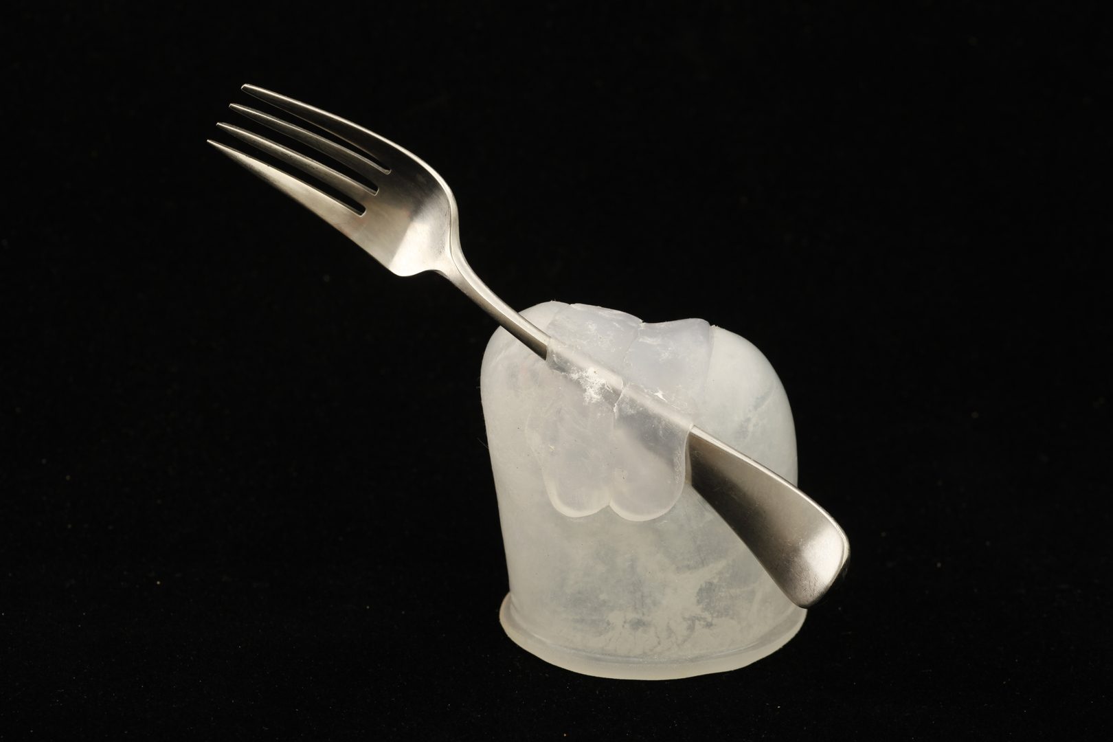 Fork for Cindy suspended in a silicone cap